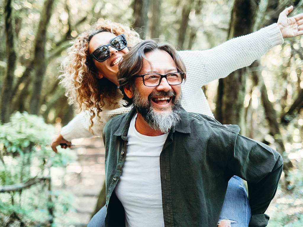 mature couple having fun together in the natural park